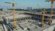 © ศิวาพร ทูปคันโธ - Aerial view of a construction site with cranes, showcasing modern industrial development and urban architecture.