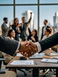 © Ethan - Diverse Business Team Celebrating Partnership with Handshake – Corporate Success Concept