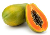 Close up of a whole papaya and a halved papaya with black seeds on a plain white background surface