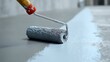 © PNG KING - A close-up shot reveals a paint roller in action, meticulously applying a fresh coat of paint on a surface, embodying the essence of home improvement and renovation.