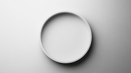 Poster - A simple, circular white object on a smooth surface, showcasing minimalist design and subtle elegance.