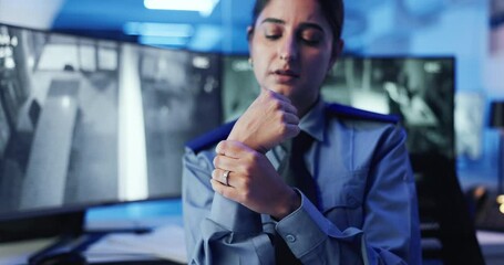 Poster - Computer screen, massage and wrist pain with woman in CCTV control room for safety or security. Arthritis, carpal tunnel and injury with Indian police officer at headquarters for law enforcement