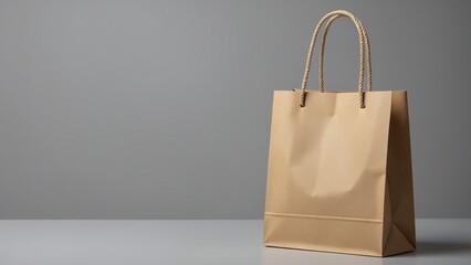 Poster - Empty brown paper shopping bag with rope handles on a light grey background, perfect for retail or environmental themes in marketing and design