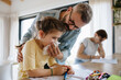 © Halfpoint - Father helping his daughter blow congested nose.