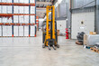 © Koldo_Studio - Forklift operator driving through warehouse aisles, managing logistics and goods distribution