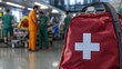 © Cyan Creative - First aid kit in a busy hospital emergency room with medical staff working