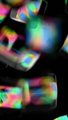 Leinwandbilder - Glossy black cubes with iridescent edges arranged on a dark background, blending illusions and technology into a sleek, modern abstract design.