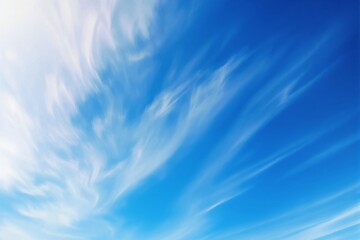 Poster - Abstract blue sky with soft white clouds in a bright atmosphere.
