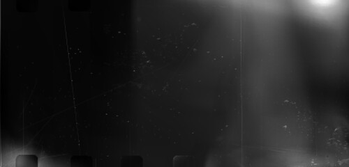 Poster - Black and white film light leak effect - analog retro photography overlay, bw grungy vintage cinema banner with glowing spotlight flare leak on dark grainy scratched bg. Old movie burned edge border