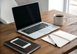 © Risat Designer - Modern Workspace Setup with Laptop, Phone, Notepad and Coffee