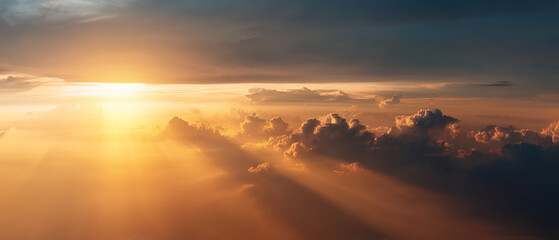 Poster - bright golden sky at dawn with sunrise casting warm light through clouds