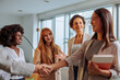 © bernardbodo - Excited new intern meeting her colleagues