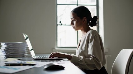 Poster - Focused businesswoman analyzing financial documents, processing tax returns with intense concentration while working at desk surrounded by paperwork during demanding professional moment