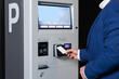 © zinkevych - Man in station scanning card to access parking system