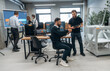 © standret - Conception of cooperation and communication. People are in the office by the 3d printer