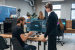 © standret - Display with 3d printing software. Designer team are together in the office