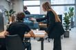 © standret - Display with 3d printing software. Designer team are together in the office