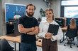 © standret - Man and woman are standing. Designer team are together in the office