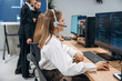 © standret - Sitting by computers. Designer team are together in the office