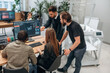 © standret - Working on a project together. Designer team are in the office
