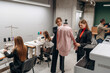 © standret - Fashion concept. People are working by the sewing machines indoors