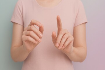 Poster - Woman wearing a pink t-shirt is making gestures with her hands, as if interacting with a virtual interface or touchscreen, against a gradient background