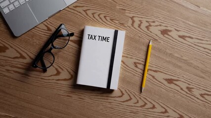 Poster - Tax time preparation with notebook, laptop, pencil, and glasses arranged on wooden desk surface, representing financial planning and accounting workspace