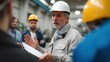 © ryker - Engineering professional leading training session in factory setting, wearing hard hat and discussing safety protocols with attentive workers. atmosphere is focused and collaborative