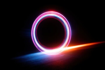 Poster - An eye-catching light painting photograph showcasing a vibrant circular pattern with neon colors, long exposure shot on a dark background with streaks of orange and blue.