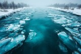 Ice floes drift on a tranquil river surrounded by foggy winter landscape in a serene natural setting