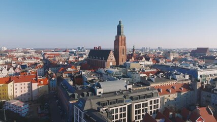 Wall Mural - aerial view of wroclaw, poland, featuring st. elizabeth's church, red roofed buildings, modern struc