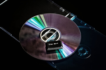 Aufkleber - A computer compact disc with a key labeled 