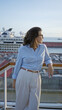 © Krakenimages.com - Woman enjoying cruise view on dock with sunlight reflecting on water emphasizing her relaxed mood and stylish attire for a memorable travel experience outdoors