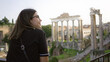 © Krakenimages.com - Woman enjoying the view of ancient roman forum in rome, italy, with a smile, capturing the essence of european history under the sun.