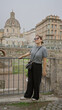 © Krakenimages.com - Young woman stands confidently at the roman forum in italy, capturing the historic charm of rome with a modern flair, exuding beauty and elegance in the heart of europe.