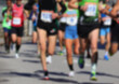 © ChiccoDodiFC - Intentionally blurred scene of runners during a road race on the asphalt road