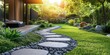 © Georg - Beautiful garden pathway with stones leading to a modern house at sunset