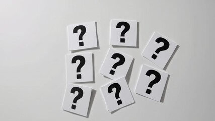 Aufkleber - Multiple question marks printed on white cards gently moving against pristine white background, representing mental exploration, uncertainty, and contemplative decision making processes