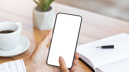 Aufkleber - View over the shoulder of girl using cell phone, touching gadget with white blank screen, mock up, copy space