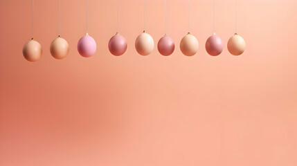 Poster - Aesthetic Pastel Spheres Suspended in a Row Against a Gradient Peach Background