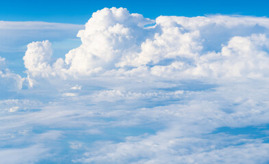 Wall Mural - Blue Sky with Fluffy White Clouds on a Sunny Summer Day. Cloudscape - Blue sky and white clouds. Background cloud summer. Sky cloud clear with sunset. Natural sky