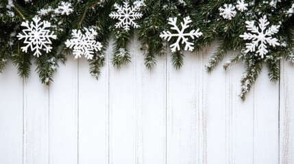 Poster - Fir branches and snowflakes frame on white wooden background, clean and natural holiday setting with copy space