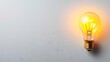 Glow Glass Bright, Glowing lightbulb on a plain white background, symbolizing bright ideas and innovation.