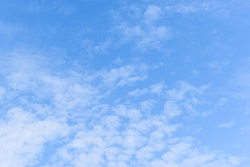 Wall Mural - beautiful blue sky and white fluffy group of clouds with sunrise in the morning, natural background