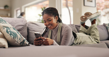 Poster - Home, relax and woman on sofa, cellphone and internet with smile, social media and funny meme. Apartment, mobile user or happy person on couch, smartphone or app for message to contact or online joke