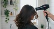 © studiothole - Hair Drying: Brunette Woman in Bright Bathroom with Plants.