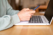 © Nanci - Mature Female Interacting With Artificial Intelligence Chatbot On Laptop And Smartphone For Online Customer Support In Financial And Travel Services