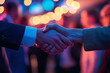 © Thomas - Attendees shaking hands at event, focus on greeting gesture and name tags in soft lighting