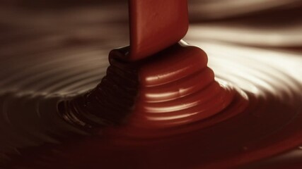 Poster - Super Slow Motion of Pouring Hot Melted Chocolate, Creating Waves Shapes, Filmed on High Speed Cinema Camera, 1000 fps. Camera in Motion. Extreme Macro Shot.