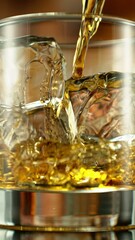 Poster - Super Slow Motion of Pouring Whiskey into Glass. Filmed on High Speed Cinema Camera, 1000 fps. Bar on Background, Low Depth of Focus. Vertical Aspect Ratio. Speed Ramp Effect.